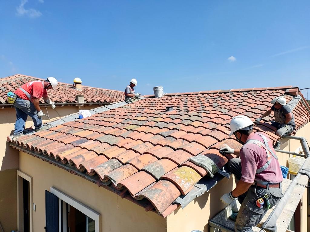 New roof tiles being laid on a villa roof